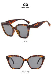 Detail view of cat-eye tortoiseshell frames with silver studs from front and side angles