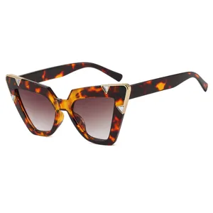 Trendy cat-eye tortoise shell sunglasses for women with triangle rhinestone accents