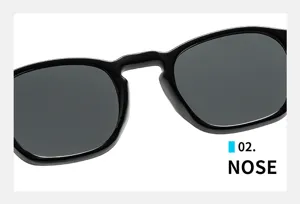 Nahaufnahme des integrierten Stegdesigns dieser stilvollen schwarzen Retro-Sonnenbrille