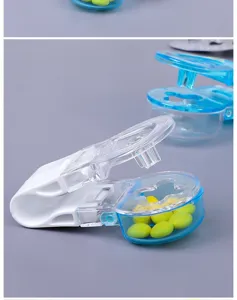 Detail view of portable pill dispenser showing internal storage with yellow pills.