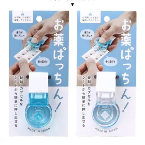 Portable manual pill puncher tool for easy tablet removal from blister packs, blue