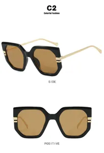 Front and side views of chunky black irregular frame sunglasses with brown lenses