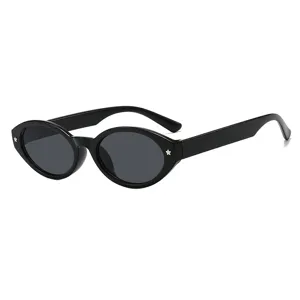 Trendy retro black oval sunglasses with small star studs for a minimalist chic look