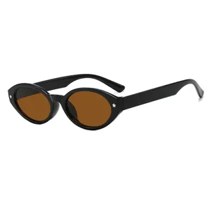 Vintage oval sunglasses with black frame and brown lenses featuring star studs