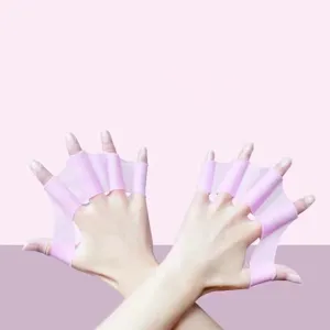 Pink silicone webbed swim gloves for adult and youth freestyle training, hands display.