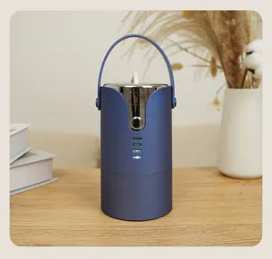 Macro view of portable blue mini clothes dryer with handle on a wooden desk background