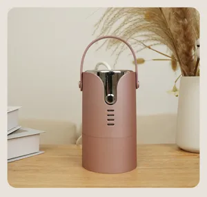 Portable mini clothes dryer with handle, pink design for home and dormitory use