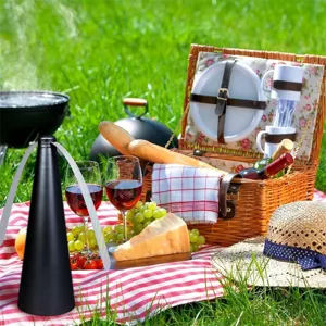 Portable battery-operated electronic fly fan for outdoor picnic use, safe black design.