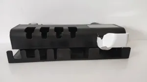 Side view of wall-mounted toothbrush holder and automatic toothpaste dispenser unit