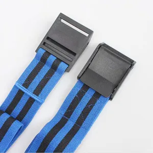 Close-up detail of BFR blood flow restriction bands with black buckles and blue stripes.