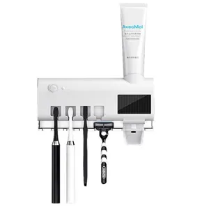 Wall-mounted smart toothbrush holder with UV sanitizer and automatic toothpaste dispenser