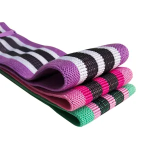 Set of three colorful fabric hip resistance bands for fitness and yoga on white background