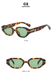 Side and front view of irregular tortoiseshell sunglasses with green lenses