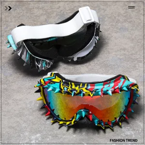 Close-up of trendy ski goggles with colorful rivet spikes and reflective lenses