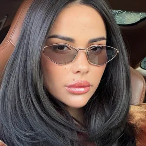 Detailed close-up view of a woman wearing stylish metal polygon small frame sunglasses