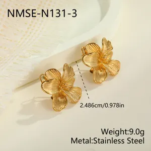 Close-up of gold-plated stainless steel flower earrings with vintage texture finish.