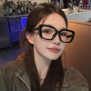 Close-up of stylish black square-framed anti-blue light glasses worn by a model