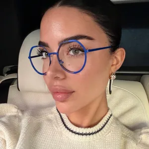 Fashionable woman wearing electric blue geometric large frame blue light glasses