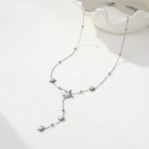 Elegant silver stainless steel Y-necklace featuring cubic zirconia eight-pointed stars