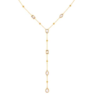 Detailed macro shot of gold Y-shaped necklace featuring pear and marquise cubic zirconia