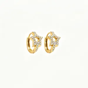 Detail shot of dainty gold-plated star hoop earrings with sparkling crystal inlay