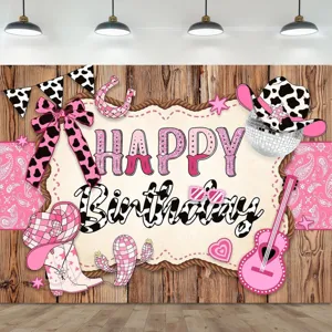 Toile de fond photo anniversaire cowgirl rose avec motifs de vaches et deco de fete.