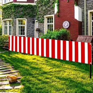 Red and white striped decorative yard banner with grommets for fence privacy and party decor.