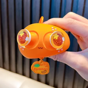 Πορτοκαλί squishy παιχνίδι μπρελόκ με μάτια που πετάγονται για ανακούφιση άγχους