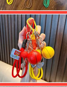 Close-up of sports keychains featuring basketball and golf ball charms on woven ropes