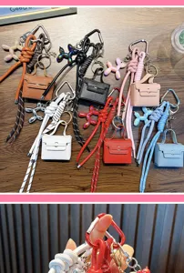 Detailed view of colorful mini PU bag keychains with balloon dog charms and ropes