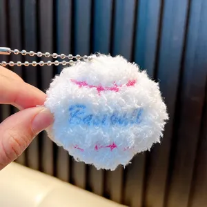 Soft white plush baseball keychain pendant with pink and blue embroidery detail
