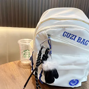 Ciondolo per borsa a forma di guanto in pelle con corda intrecciata e clip in metallo