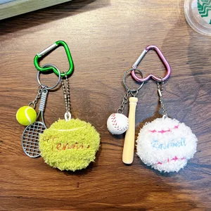 Plush sports keychain set featuring tennis and baseball designs with heart carabiners