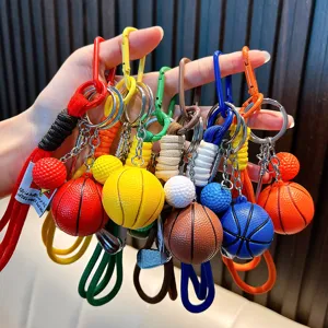 Colorful basketball and golf ball keychains with braided rope for sports gifts.