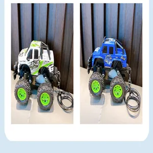 Detail view of cartoon off-road pickup truck keychains in white and blue colors.