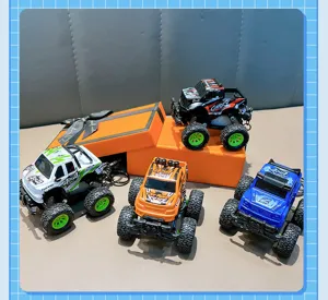 Detail of mini off-road pull-back truck keychains in various colors with gift box
