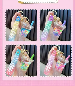 Detailed view of four colorful bubble tea cup liquid quicksand keychains