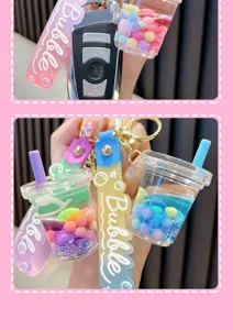 Detail of bubble tea cup keychain with colorful candy beads and liquid quicksand effect