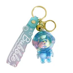 Schattige blauwe acryl astronaut sleutelhanger met vloeiende kleurrijke bedeltjes
