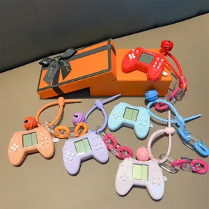 Colorful retro mini handheld game console controller keychains presented in gift box