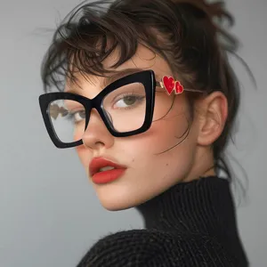 Close-up of stylish cat-eye glasses frame with red heart details on the temple.