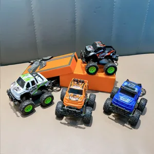 Set of 4 colorful cartoon pull-back off-road monster truck keychains for kids' backpacks