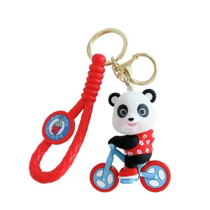 Cartoon panda riding bicycle keychain made of durable PVC soft rubber for bags and keys
