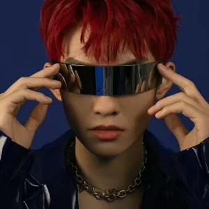 Close-up of futuristic silver mirrored visor sunglasses worn by a stylish male model