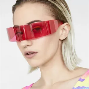 Detailed view of red futuristic wrap-around sunglasses worn by a fashion model in a stylish setup