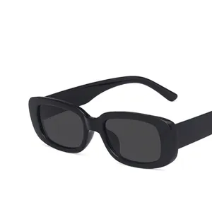 Trendy black rectangular small frame sunglasses with a minimalist sleek modern design