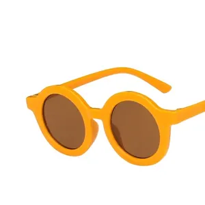 Gafas de sol redondas amarillas para niños con protección UV y lentes marrones
