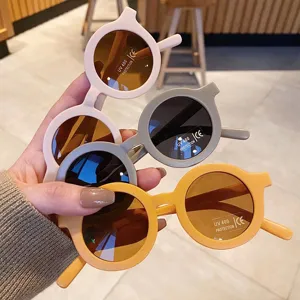 Macro view of cute round children's sunglasses with UV400 protection stickers on lens
