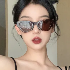 Close-up portrait of a female model wearing stylish tortoiseshell cat-eye sunglasses