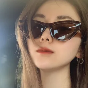 Stylish close-up of women's vintage cat-eye sunglasses featuring tortoiseshell frames